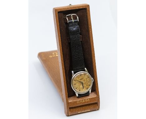 Omega- a gentleman's 1950's steel cased Omega wristwatch, comprising a signed champagne dial with applied steel arrow batons 