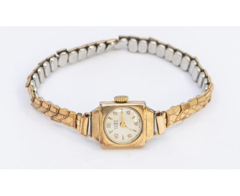 A ladies vintage 9ct gold 'Frey' wristwatch, comprising a round silvered dial with applied Arabic and baton gilt markers, squ