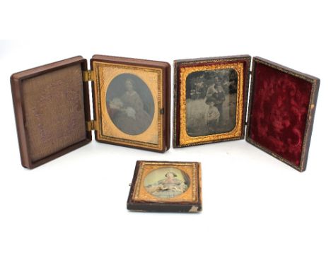 Three Victorian ambrotype framed portraits in cases.