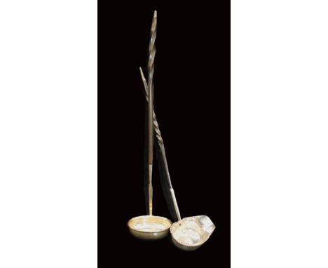 An early 18th century long white metal toddy ladle, having part twisted baleen handle and bowl inset with a 1711 gilt coin, u