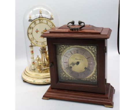 A mid 20th Century West German anniversary dome clock along with another mid 20th Century mantle clock.