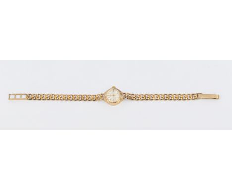 A ladies vintage 9ct gold Ingersoll wristwatch, comprising a round signed silvered dial with applied baton markers, faceted b