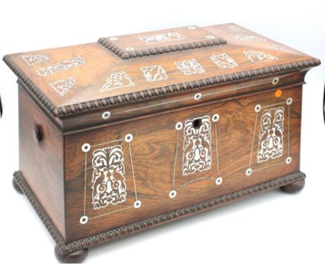 A late 19th Century mahogany inlaid large tea caddy with green and black internal compartments, inlaid with mother of pearl, 
