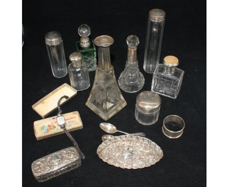 A collection of mixed silver topped / collared glass perfume, scent or other bottles to include: a George V silver topped sce