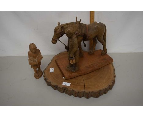 Carved oak figure of a man leading a horse, initials AW to base together with a further similar model of a figure with a book