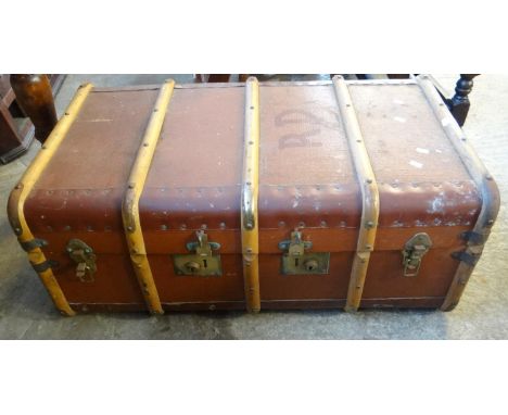 Vintage canvas wooden and metal banded travelling trunk with carrying handles.  (B.P. 21% + VAT) 
