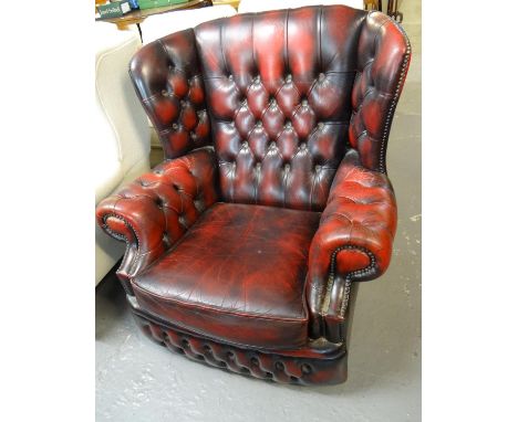 20th century leather ox-blood button back Chesterfield style wing armchair.  (B.P. 21% + VAT) 