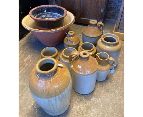 Collection of stoneware items, to include: flagons, utensil jars, mainly appearing unmarked together with a dairy pan and ano