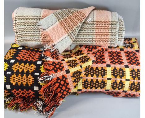 Two vintage woollen blankets or carthen; one Welsh tapestry on black ground with fringed edge and traditional Caernarfon desi