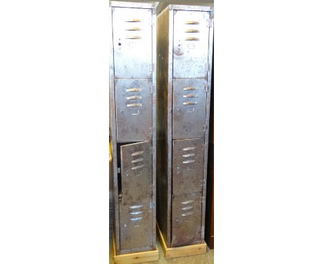 Pair of vintage industrial metal four door gym lockers on wooden pine stands.  (2)  (B.P. 21% + VAT) 