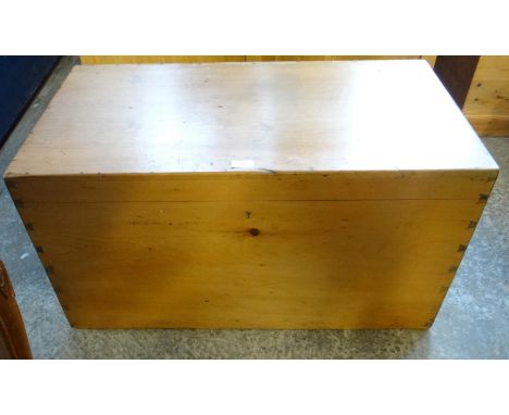 19th century pine blanket box/trunk of rectangular plain form with metal carrying handles.  (B.P. 21% + VAT) 