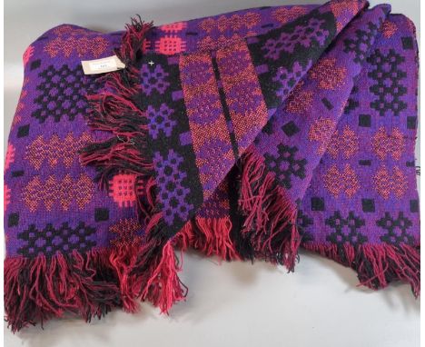 Vintage woollen Welsh tapestry purple ground blanket or carthen with fringed edge and 'Derw Products, Made in Wales' label. (