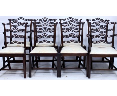 A SET OF EIGHT MODERN CHIPPENDALE STYLE LADDERBACK MAHOGANY DINING CHAIRS with inset seats (two carvers and six standards)
