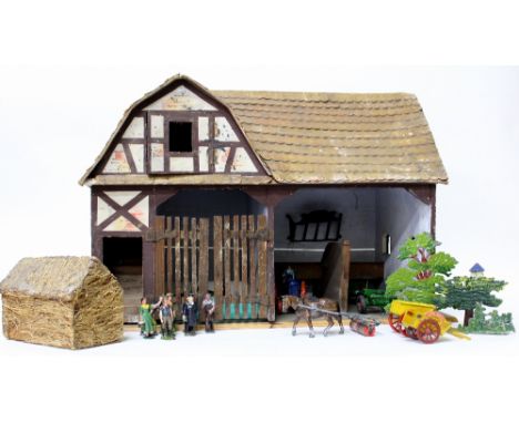 AN OLD PAINTED WOODEN MODEL  of a barn together with various die cast toys to include an early tractor, a horse pulling a rol