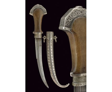 dating: circa 1900 provenance: Morocco Curved, single -and false-edged blade, the base engraved and marked "Mbau Mesoa"; silv