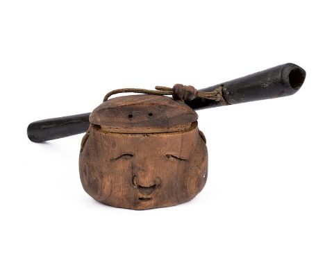 dating: late 19th Century provenance: Japan Black, wooden pipe case with opening for the pipe. Wooden inro depicting a human 