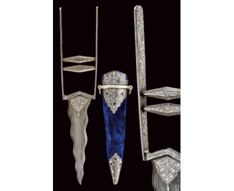 dating: 20th Century provenance: India Undulated, double-edged blade with damask drawing, silver decorations at the forte, ty