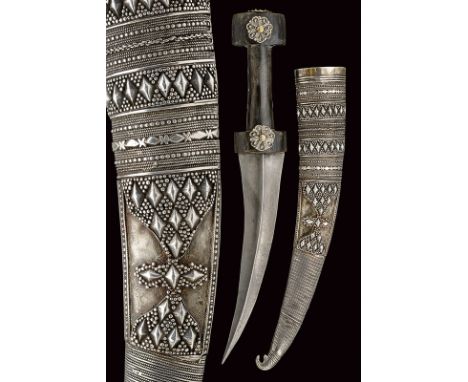 dating: 19th Century provenance: Balkans Curved, double-edged, damask blade, raised at the centre; black, horn grip shaped as