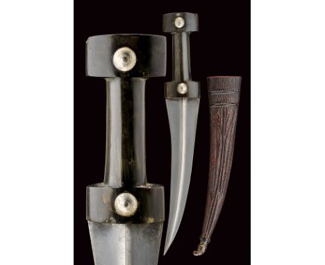 dating: circa 1900 provenance: Balkans Curved, double-edged, wootz damask blade with a raiser at the centre; "T"-shaped, dark