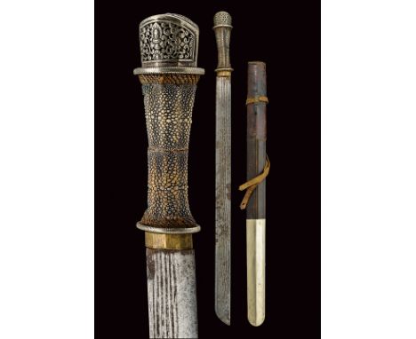 dating: 19th Century provenance: Bhutan Heavy, straight, single-edged blade with grooves; wooden grip with ray-skin covering 