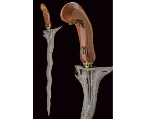 dating: late 19th Century provenance: Giava Undulated, double-edged blade chiselled with grooves at the base; brass mendak. C