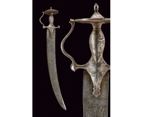 dating: 19th Century provenance: India Wide, curved blade, finely chiselled with hunting scenes featuring hunters, tigers, bu