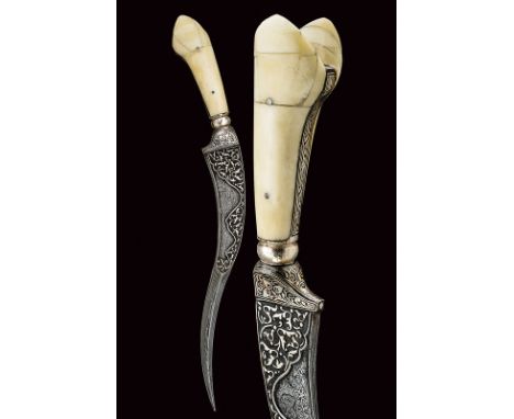 dating: 20th Century provenance: India Curved, damask blade with strengthened tip, the first part engraved with floral motifs