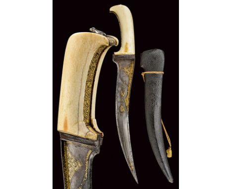 dating: 18th Century provenance: India Massive, curved, single-and false-edged, wootz damask blade, the tip strengthened, a c