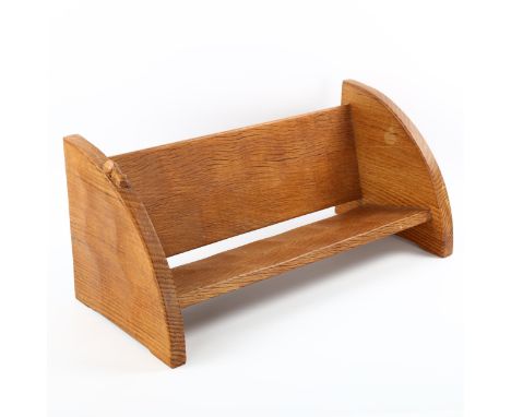 A Robert "Mouseman" Thompson oak book rack, L46cm x D20cm x H20cmGood original condition, age related patina. 