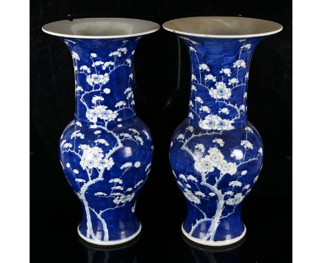 A pair of large Chinese blue and white 'Prunus' Yen-Yen vases, decorated in underglaze blue with Prunus, Kangxi marks but cir