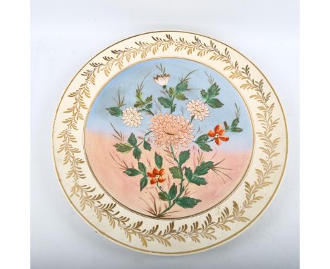 A large Royal Doulton pottery charger, with painted floral panel, diameter 50cmA few light surface scratch marks, no chips cr