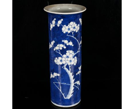 A Chinese blue and white 'Prunus' sleeve vase, underglaze blue decoration, Kangxi mark but probably circa 1900, height 35cm, 