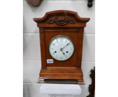 An oak bracket clock.