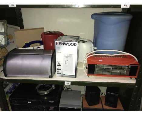 A shelf of Kitchenalia including steam iron, electric can opener etc.