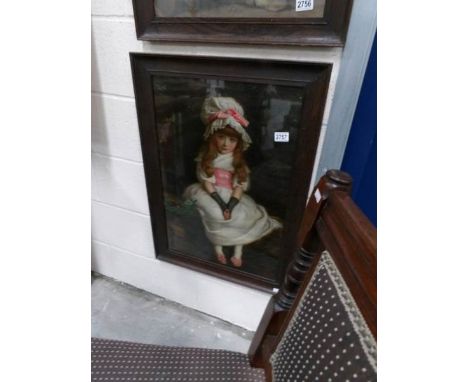 An oak framed and glazed print of a young girl.