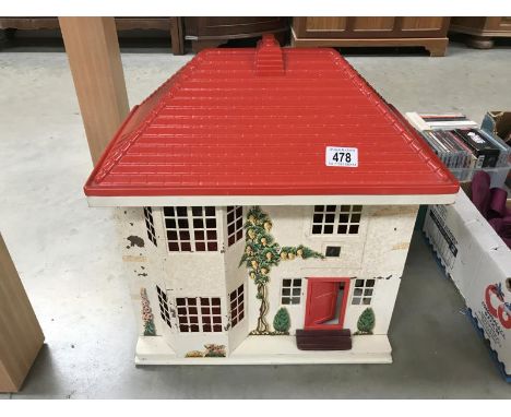 A Tri-Ang dolls house with furniture