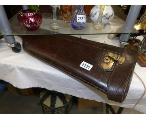 A leather gun case.