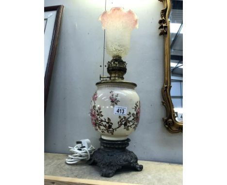 A Victorian oil lamp converted to electric (shade a/f).