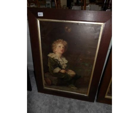 An oak framed Bubbles print (no glass).