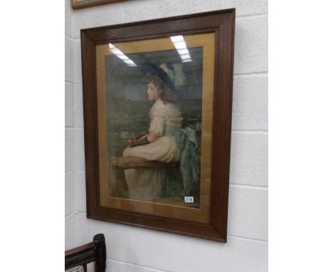 An oak framed and glazed print of a young girl.