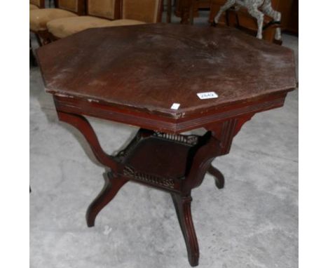 An octagonal occasional table with galleried under shelf.