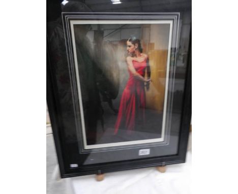 A framed and glazed limited edition print (9/280) of a lady, signed M J Neale.
