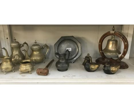 A shelf of brass &amp; pewter including tea set &amp; bell gong etc.