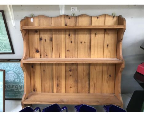 A pine wall rack/shelf.