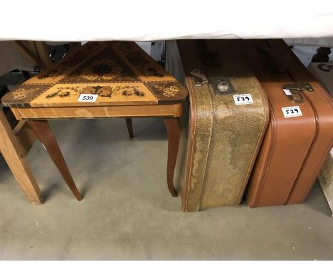 2 vintage suitcases and a musical side table