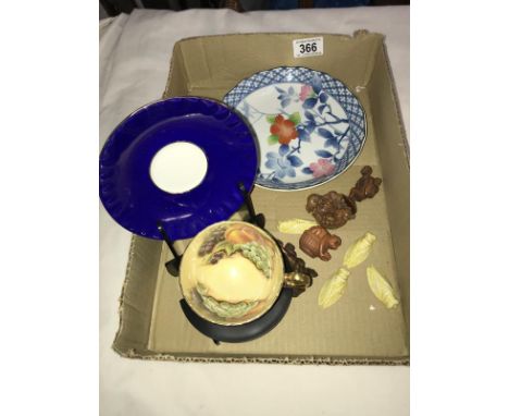 A mixed lot including netsuke, figures, a Chinese plate and an Aynsley cup and saucer.