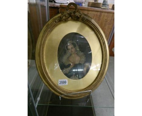 A 19th century gilt framed and glazed oval watercolour portrait of a lady,