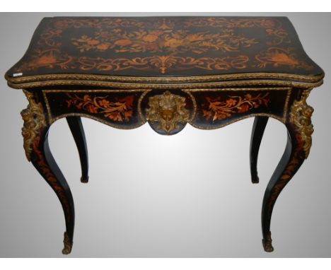 An exceptional 19th century French ebony and marquetry card table.