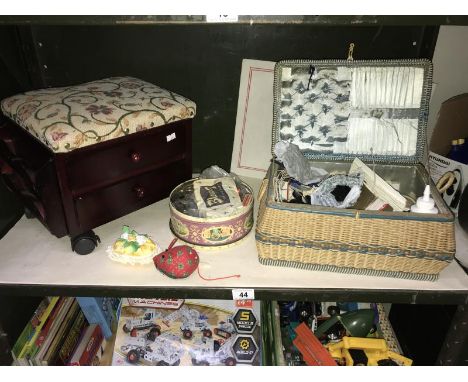 A vintage wicker sewing basket and contents, tin of buttons, work stool etc.