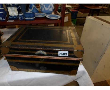 A vintage tin cash box.